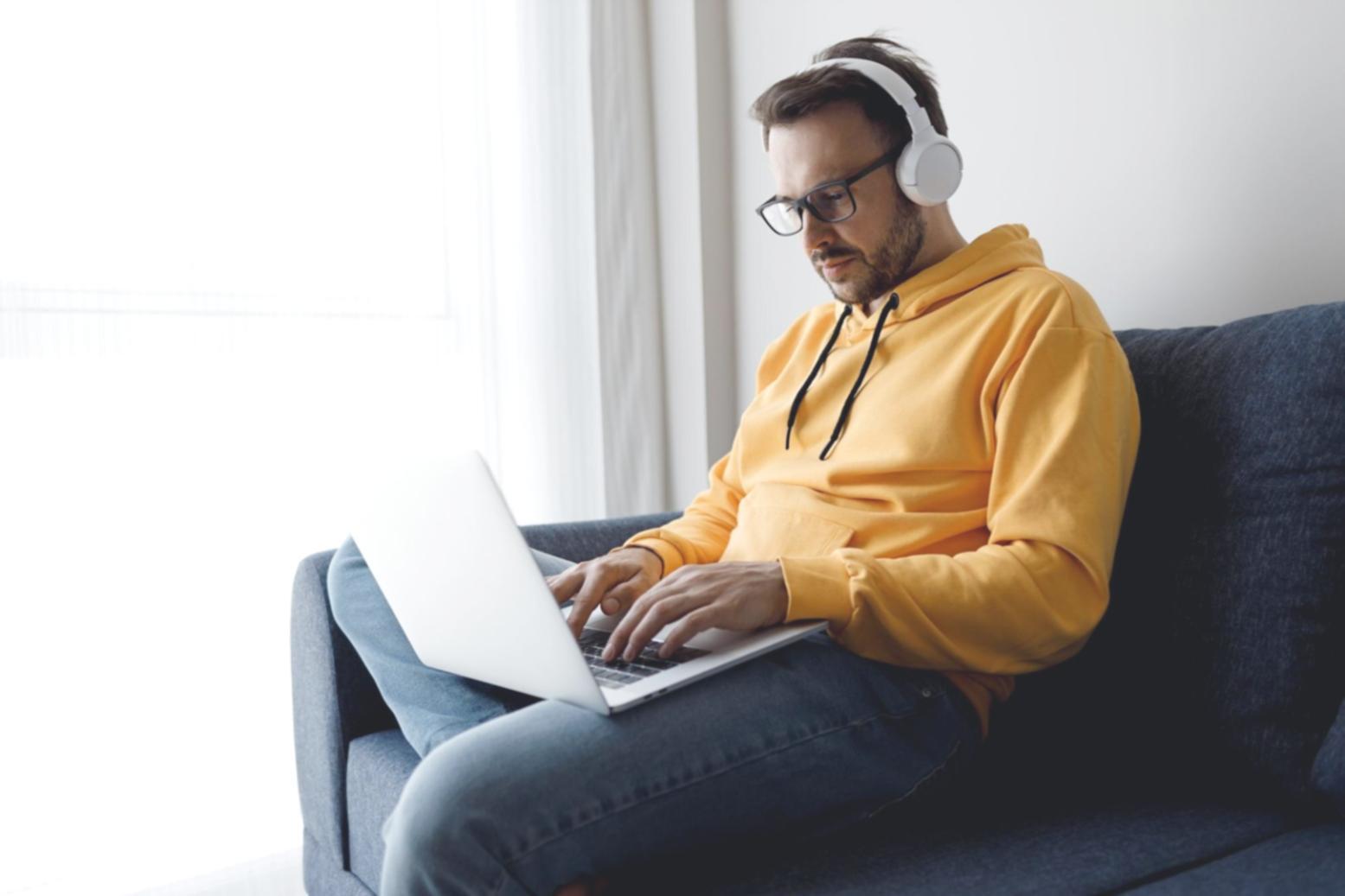 Financial professional analyzing complex market data on multiple computer screens showing various economic charts