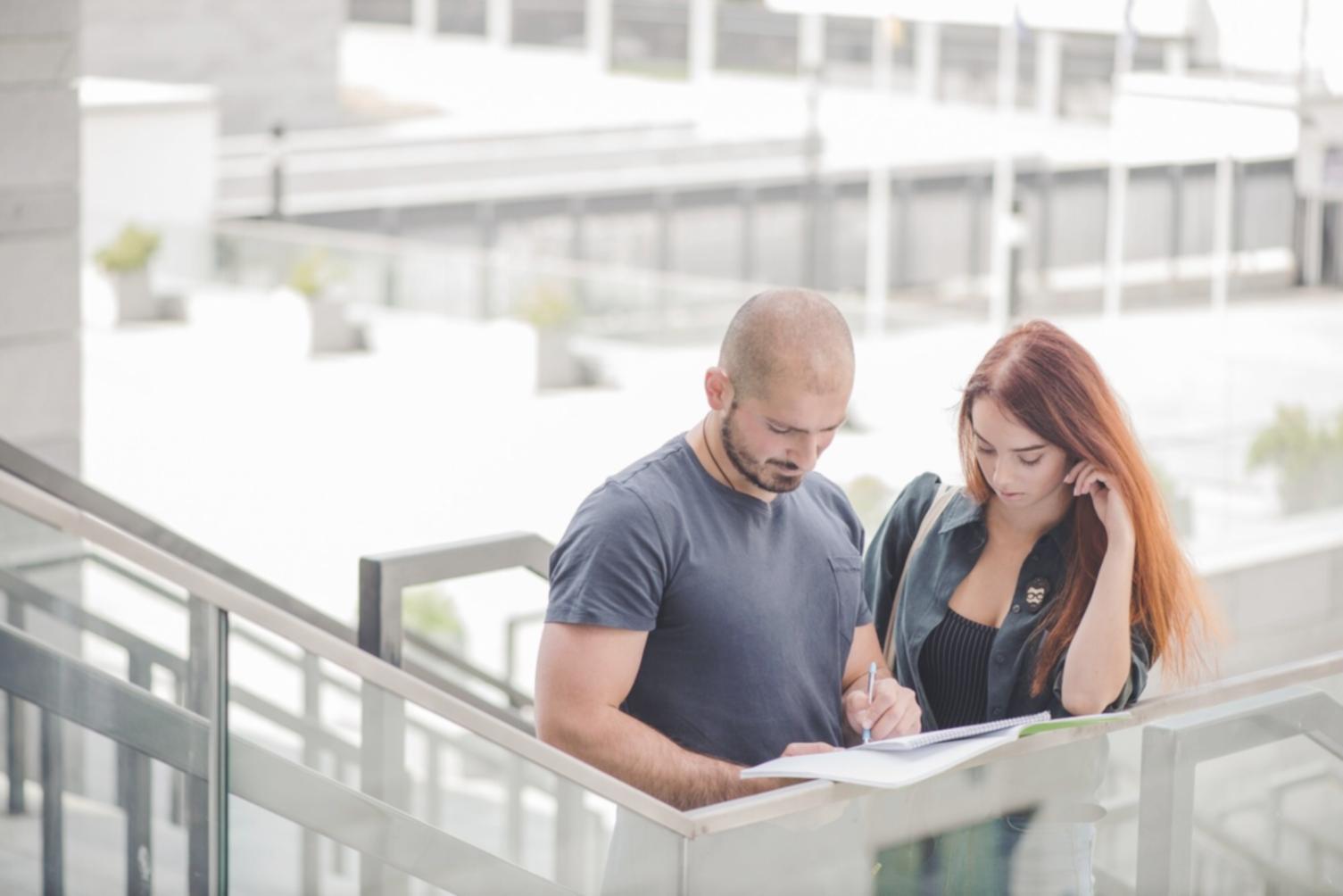 Professional trader analyzing multiple economic indicators and market correlations on screens
